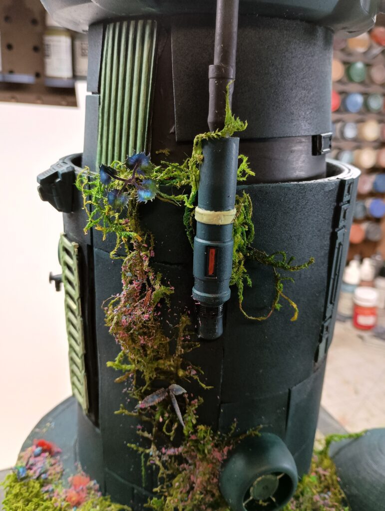 A sci-fi tower overgrown with alien plants