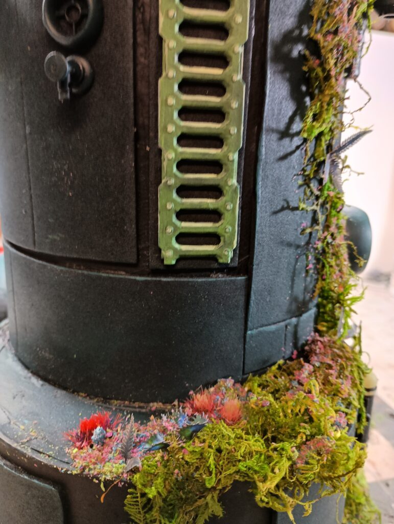 A sci-fi tower overgrown with alien plants